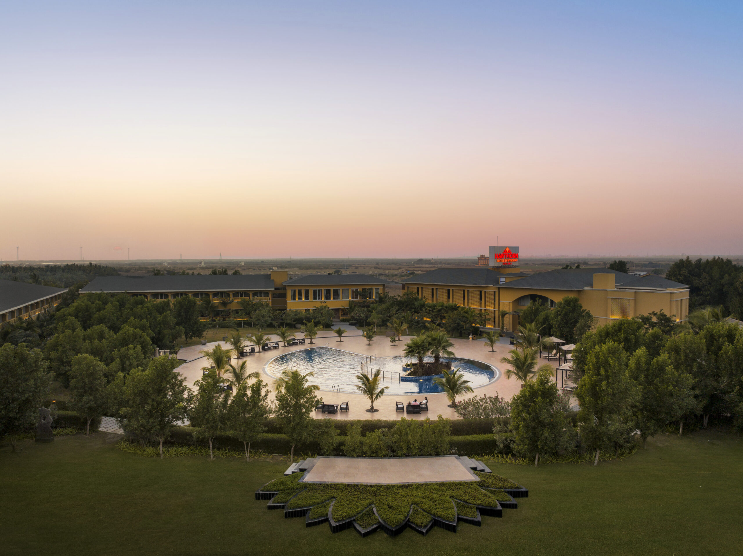 Aerial view of Hawthorn Suites by Wyndham Dwarka at dusk